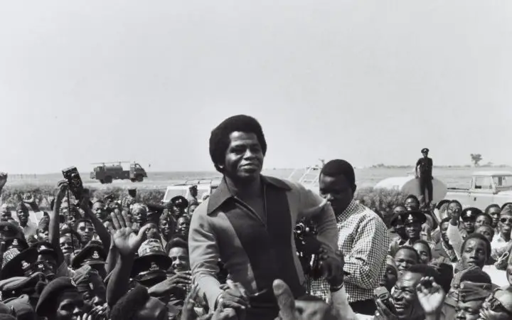 Singer James Brown being greeted by fans upon his arrival at Kaduna Airport, 1970