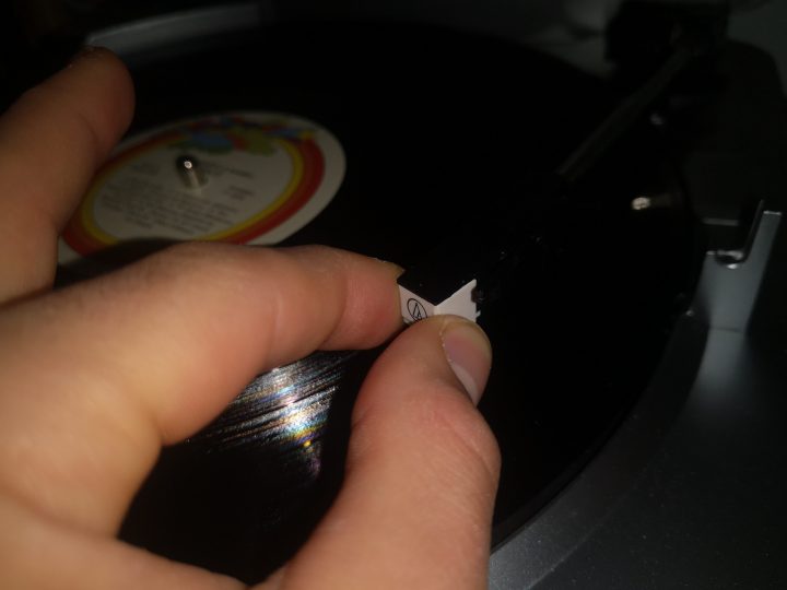 Step 2 on how to change the needle on a player: Pull the Old Stylus Out